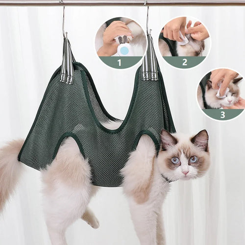 Cat resting in the grooming hammock with paws through the leg openings